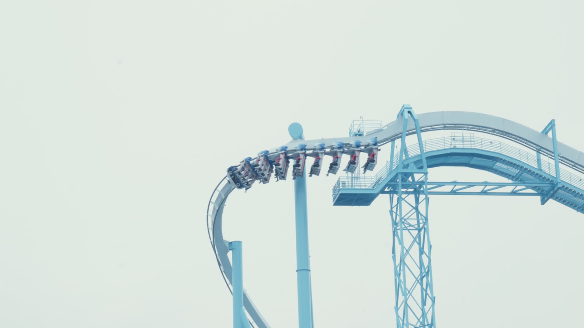 A coaster train at the edge of a steep drop at Busch Gardens Williamsburg